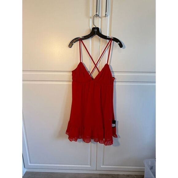 Spaghetti strap chiffon baby doll dress with a v-neckline, crisscross back, and - Picture 4 of 10